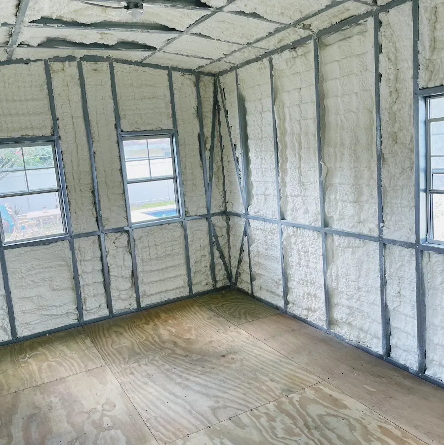 Closed-cell spray foam insulation applied to wall cavities in a residential project in Willis